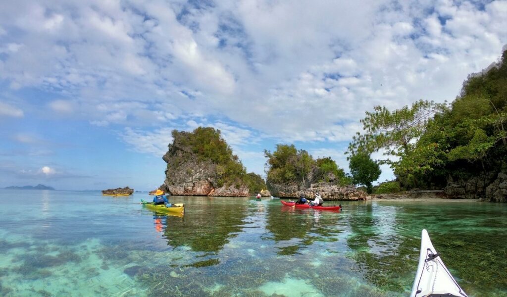 Sea kayakking in the Raja Ampat archipelago with Jakare liveaboard.
